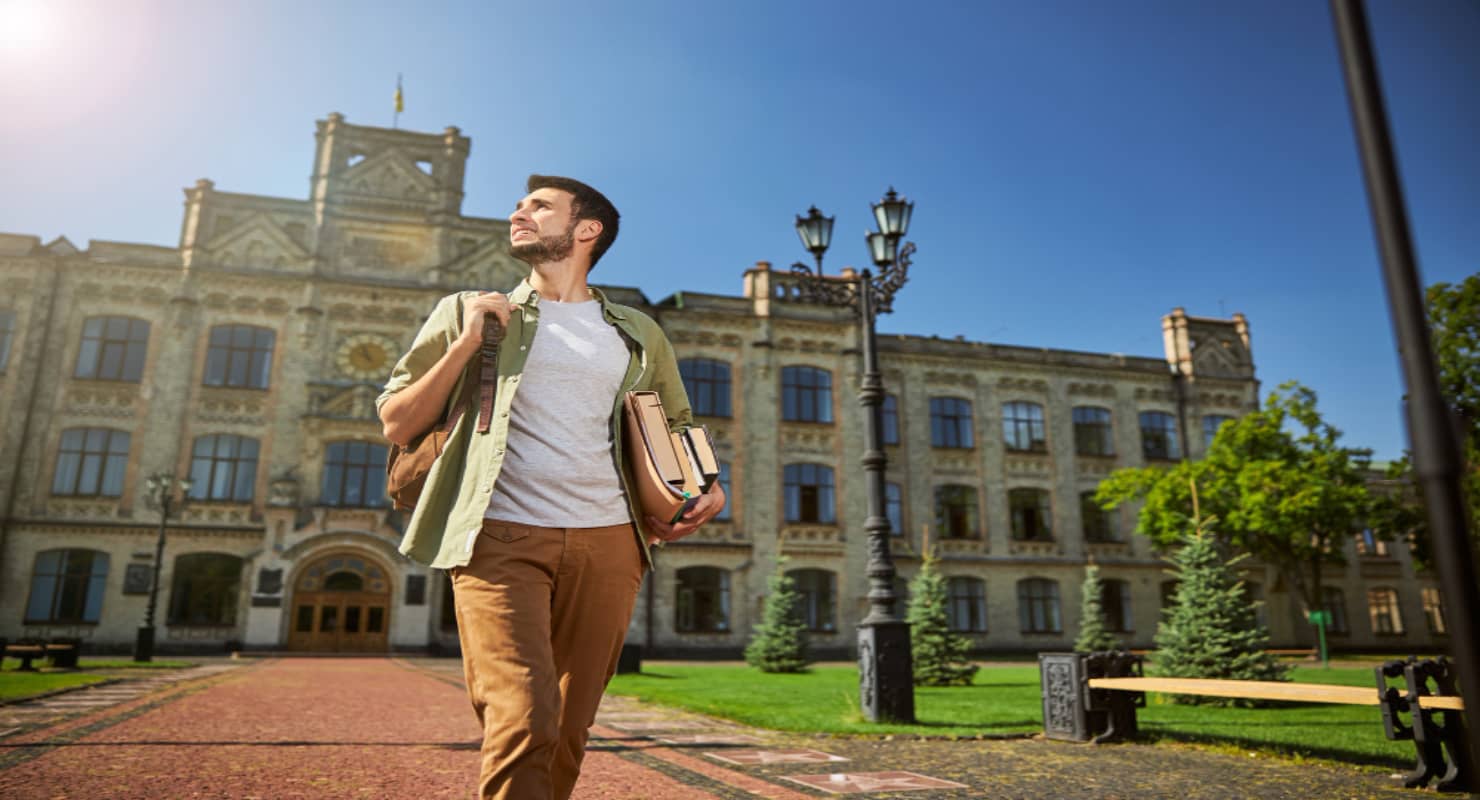Low angle of an undergraduate with books