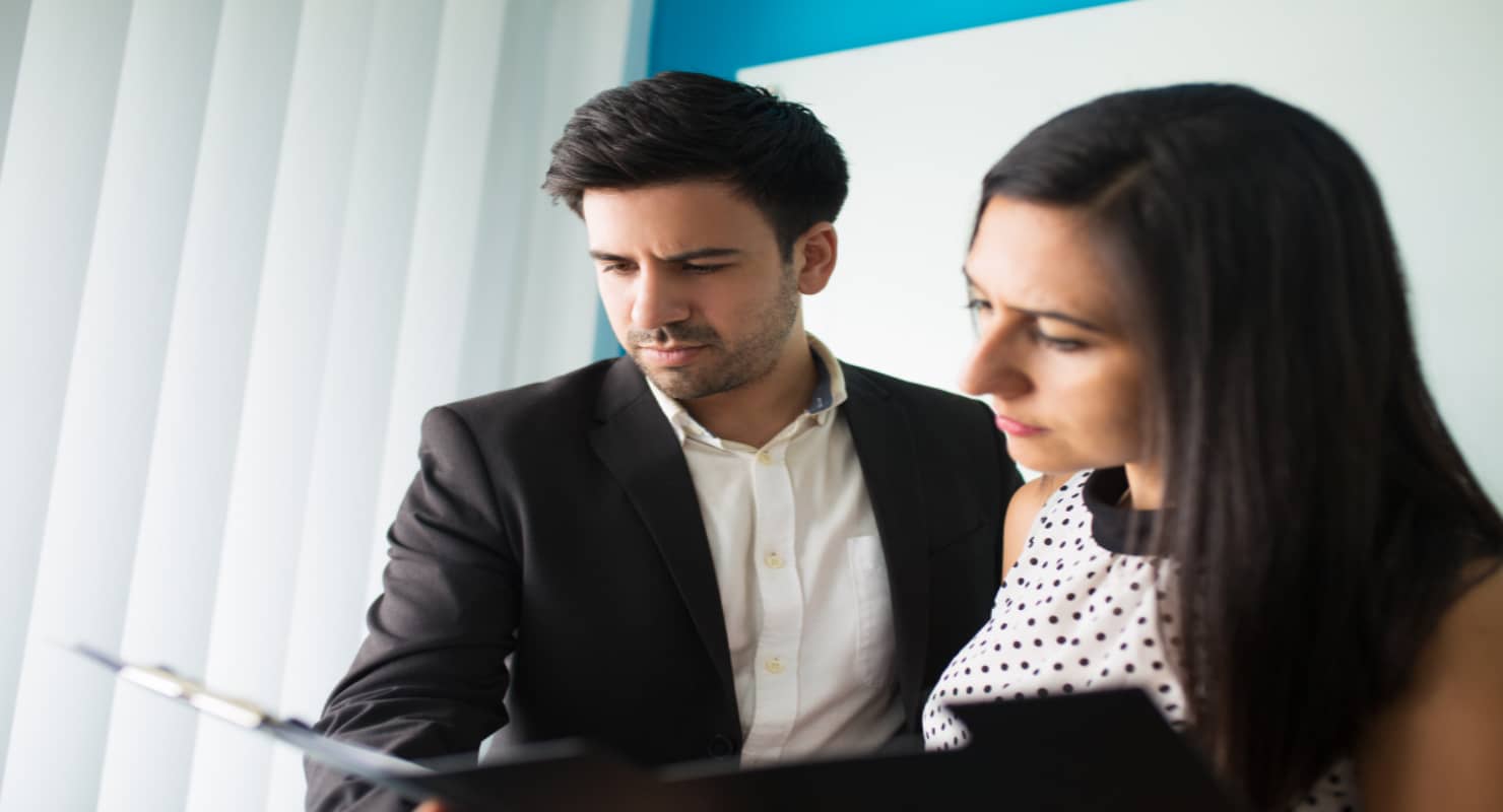 Portrait of serious male and female colleagues