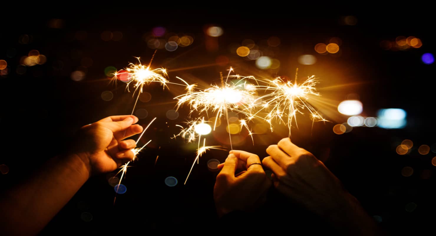 Celebrating with sparklers in the night