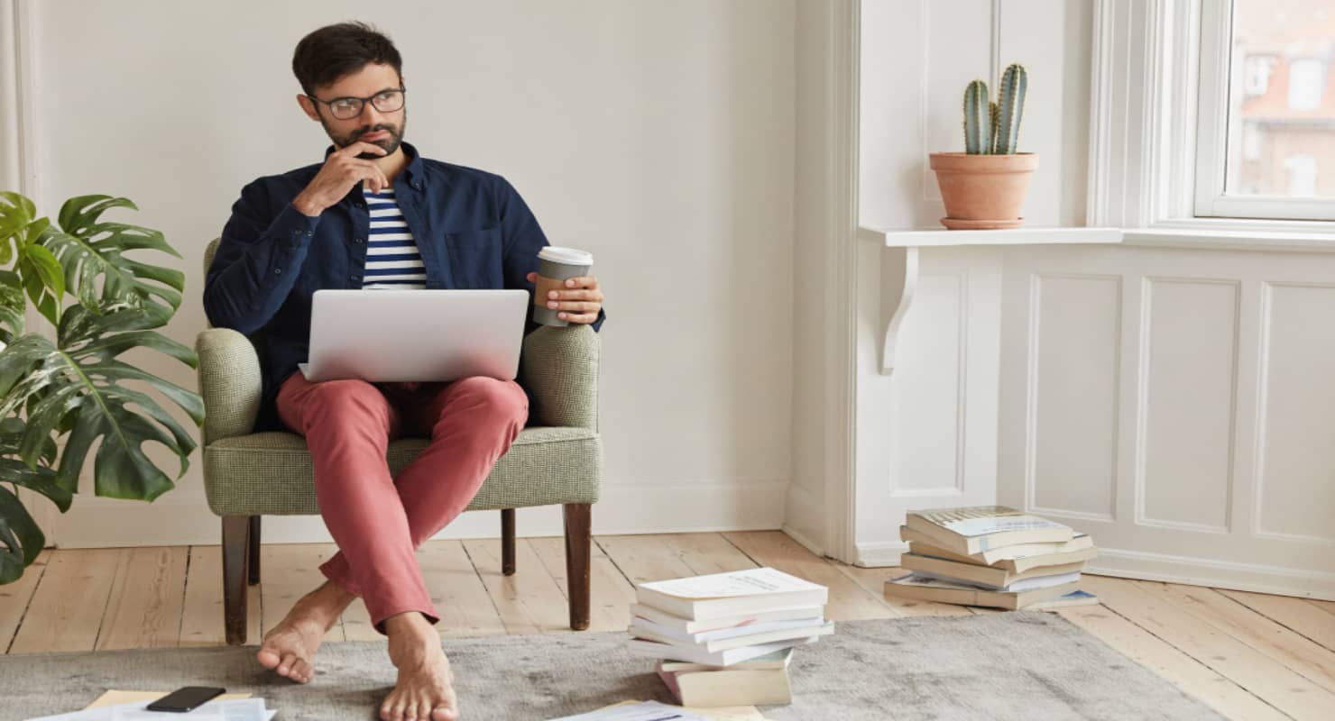 Businessman posing in cozy apartment